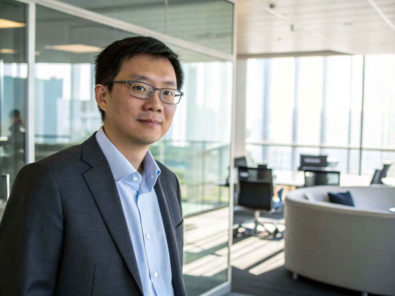 A professional headshot of Mr. Anthony E, the founder of Emrose E-World, in a modern office setting, exuding confidence and expertise.